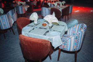 a table in a restaurant with a white table cloth at opal legacy luxor in Luxor +129 photos