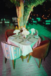 a table with plates and napkins on top at opal legacy luxor in Luxor
