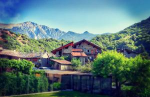 a group of houses with mountains in the background at Moncervin in Saint Vincent