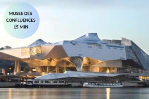 a large building with a building with the words musicdocs conferenceiuses at Night Express - Parking Gratuit Lyon Sud in Saint-Genis-Laval