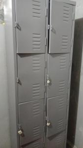 a group of grey lockers in a room at Itaúna Surf Camping in Saquarema