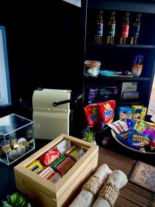 a table with a box of food and a refrigerator at The BaaHouse Suite in Donegal
