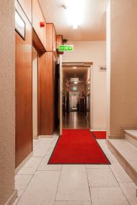 a hallway with a door leading to a hallway with a door leading to a at Hotel Aviv Dresden in Dresden