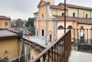 a view of a building from a balcony at Cozy home away in Lecco