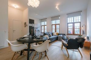 a living room with a table and a couch at Apartment near Antwerp Cathedral in Antwerp