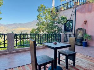 a table and two chairs sitting on a patio at Dar Soulaimane in Marrakesh