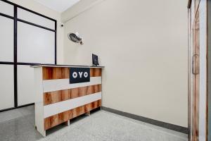 an office with a desk with a sign on it at SPOT ON VS in Delhi