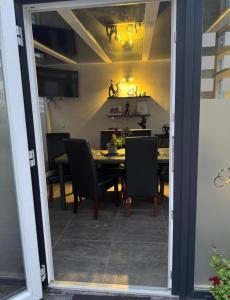 a dining room with a table and chairs at Nassauer Hof Wiesbaden-Schierstein in Wiesbaden