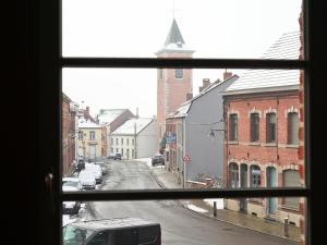 a view of a city street from a window at Cosy Duplex pour 4 personnes à Soignies in Soignies