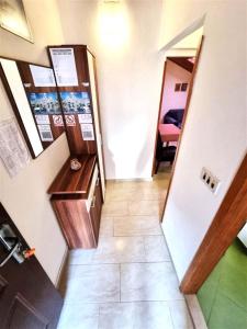 a hallway of a room with a counter and a door at Apartmani Banić Apartman 5 in Postira +13 photos