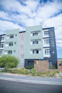 a building on the side of a street at Beachside Modern Holiday Apartments in Cape Town