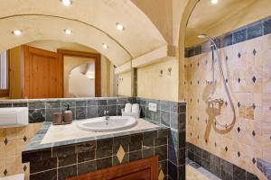 a bathroom with a sink and a shower at Villa Sophia in Port d'Andratx +28 photos