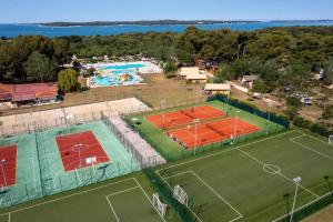 an aerial view of a tennis court with two courts at Camping Bi Village - Maeva Vacansoleil in Valbandon