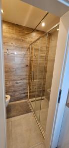 a bathroom with a shower and a toilet at Vila FERIE in Nová Lipnica +44 photos