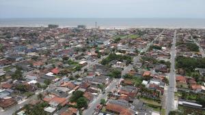 an aerial view of a city with houses at JK Casa de Praia in Ilha Comprida