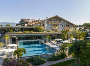 an aerial view of a hotel with a swimming pool at Weinegg Wellviva Resort in Appiano sulla Strada del Vino