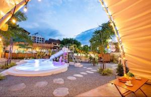 a water park with a water slide and a playground at kingdom glamping in North Pattaya