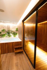 an indoor jacuzzi in a house with a hot tub at Zi One Luxury Hotel in Pereira