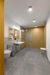 a bathroom with a toilet and a sink at StadlTraum Falkenberg in Moosach +18 photos