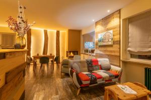 a living room with a couch and a table at Hirondelle Locanda Vegana in Aosta