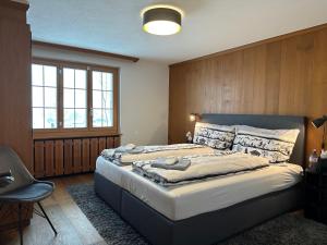 En eller flere senge i et værelse på Chalet Acadia