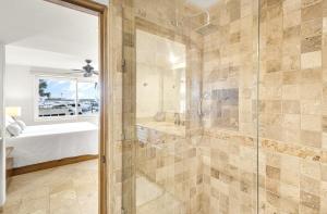 a master bathroom with a shower and a tub at The OceanFront Private Residence in La Paz +40 photos