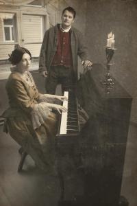 a man and a woman standing next to a piano at Lang Resort in Raahe