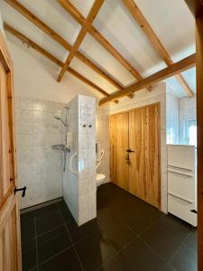 a large bathroom with a shower and a toilet at Erfgoed & Logies Den Heijkant in Moergestel +75 photos