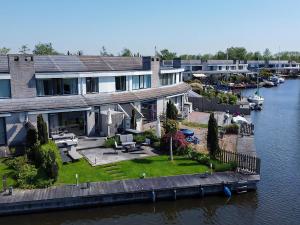 an aerial view of a house on the water at Park Brekkense Wiel 069 in Lemmer