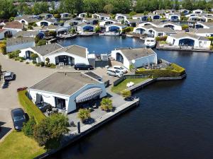 an aerial view of a harbor with houses and boats at Aquaronde 050 in Lemmer +6 photos