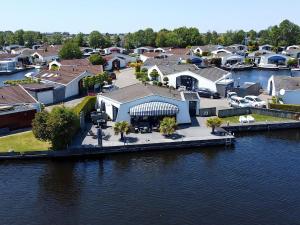 an aerial view of a house on the water at Aquaronde 050 in Lemmer
