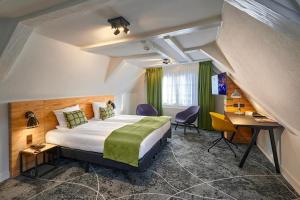 a hotel room with a bed and a desk at Nova Hotel in Amsterdam +45 photos