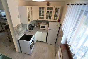 an overhead view of a kitchen with white appliances at Andrea Chata in Štrba