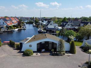 a town with a marina with boats in the water at Aquaronde 110 in Lemmer