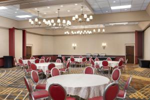 a conference room with tables and chairs in it at DoubleTree by Hilton Cincinnati Airport in Hebron +33 photos