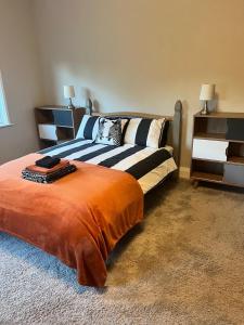a bedroom with two beds in a room at Greenways House in Lancaster