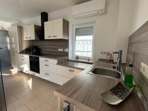 a kitchen with a sink and a counter top at Ferienhaus Weimarer Land in Berlstedt
