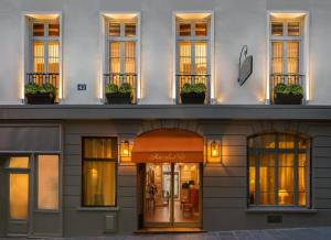 a facade of a building with windows at Hôtel Saint-Paul Rive-Gauche in Paris