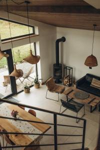 a living room with a table and a wood stove at Гірські будиночки in Zhdenievo