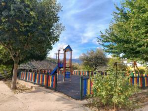 a playground with a slide in a park at ALOJAMIENTO TURISTICO LAS SOLANERAS in Solana del Pino
