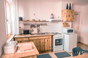 a kitchen with a sink and a stove at Haffliebe in Ueckermünde