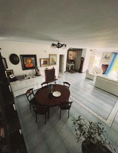 a living room with a table and a couch at Villa Rosa in Torre del Greco