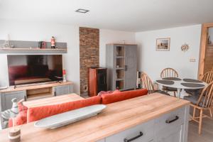 a living room with a couch and a table at Turmhaus Mönkebude in Mönkebude
