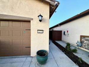 a garage with a clock on the side of a house at Attached Guest House in Woodland