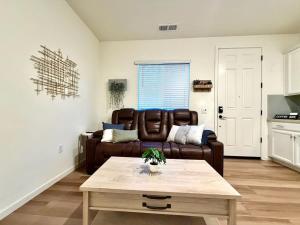a living room with a couch and a coffee table at Attached Guest House in Woodland