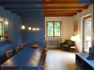 a dining room with a long table and chairs at King Ludwig's Old Neighbour in Schwangau