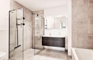 a bathroom with a glass shower and a sink at Duinhof in Cadzand-Bad +62 photos