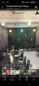 a view of a room with chairs and a table at Shanti palace and restaurant Ayodhya 1500 mtr Sri Ram Mandir ,near ayodhya dham railway station in Ayodhya