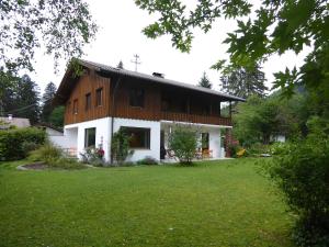 a house with a green lawn in front of it at King Ludwig's Old Neighbour in Schwangau