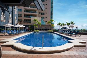 a swimming pool in the middle of a building at Catalonia Santo Domingo in Santo Domingo